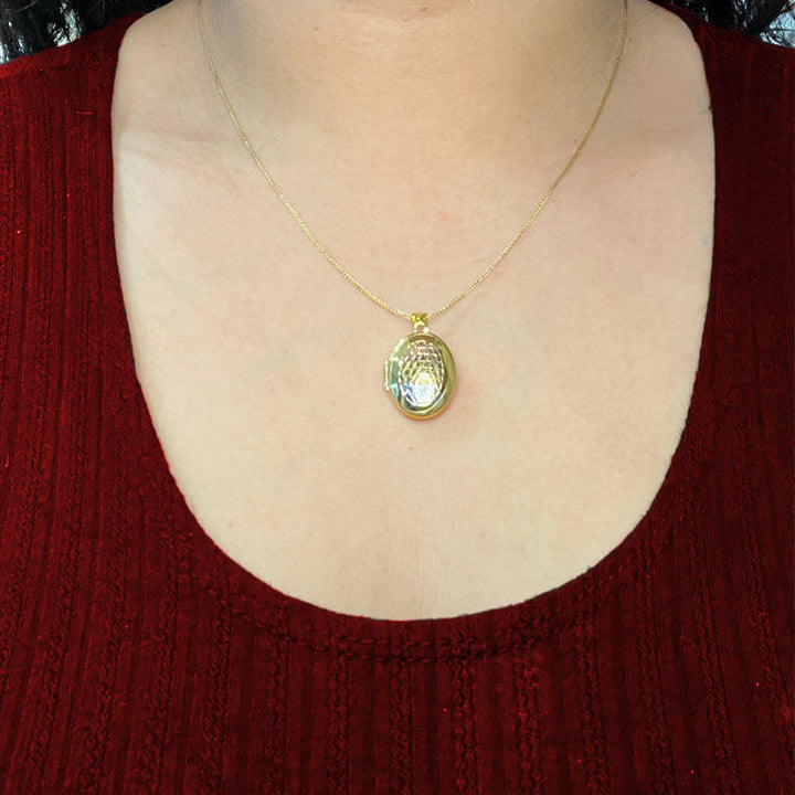 10K Yellow Gold Oval Locket With Tri Color Oval Laser Cut Floral Pattern